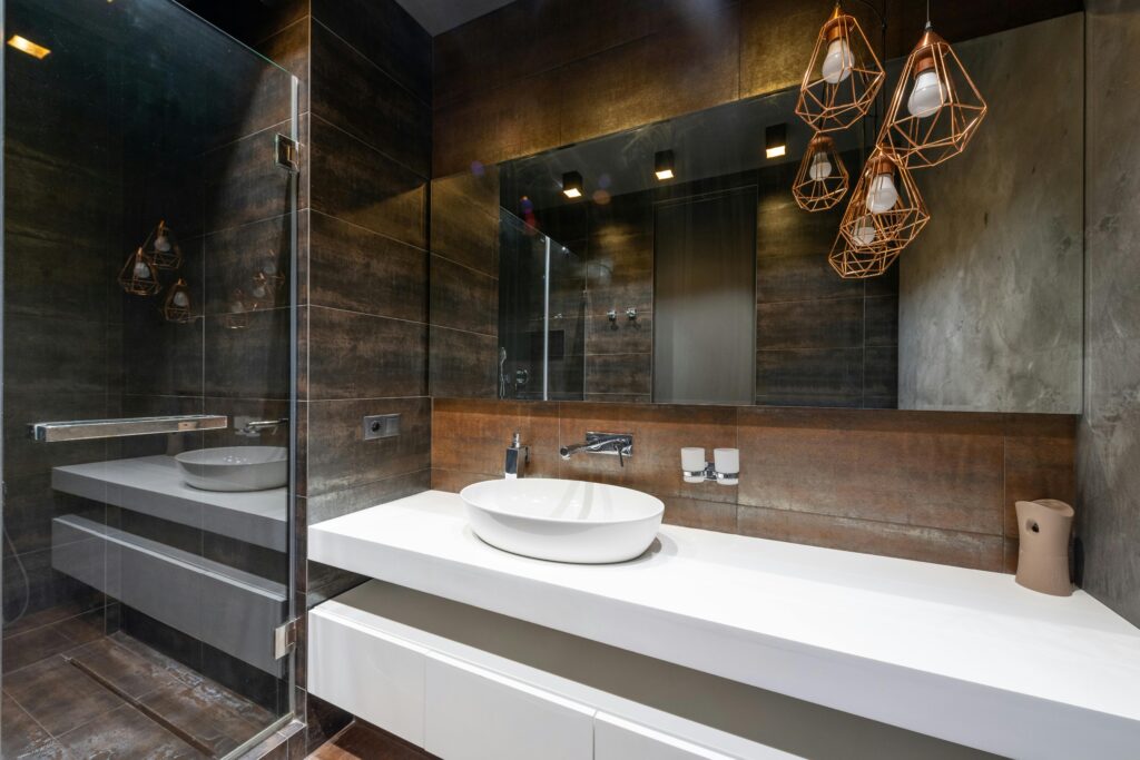 pexels-photo-8089092-8089092 A sleek modern bathroom featuring pendant lighting and a contemporary sink.